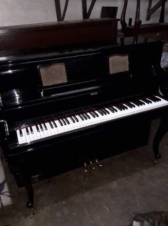 Piano Upright (Category: Musical Instruments) located in Manila. Submitted by markedison35217 (Listing ID 1451852550, Image 1). Description: Piano Upright for sale well used need lang ayusin ang strings and may unting scratches Trebel is a historic piano brand made in the Philippines, closely linked to Filipino inventor Roberto del Rosario. These pianos were built locally using native woods during the late 20th century, though many units face tun
