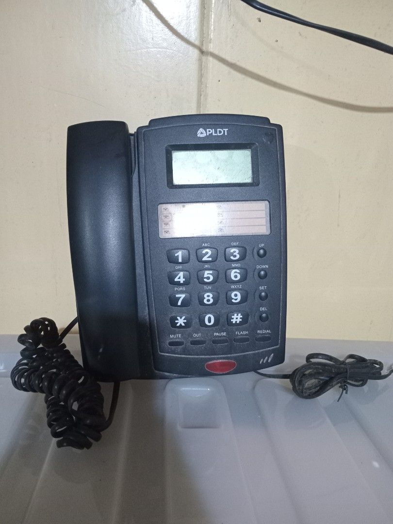 PLDT Corded Telephone with LCD Display (Category: Office & Business Technology) located in Baguio. Submitted by loweasel (Listing ID 1451716500, Image 2). Description: - PLDT corded telephone - LCD screen for caller ID and information - Standard keypad with mute, pause, and redial buttons - Includes handset and coiled cord - Main phone unit included - Ready for immediate use.