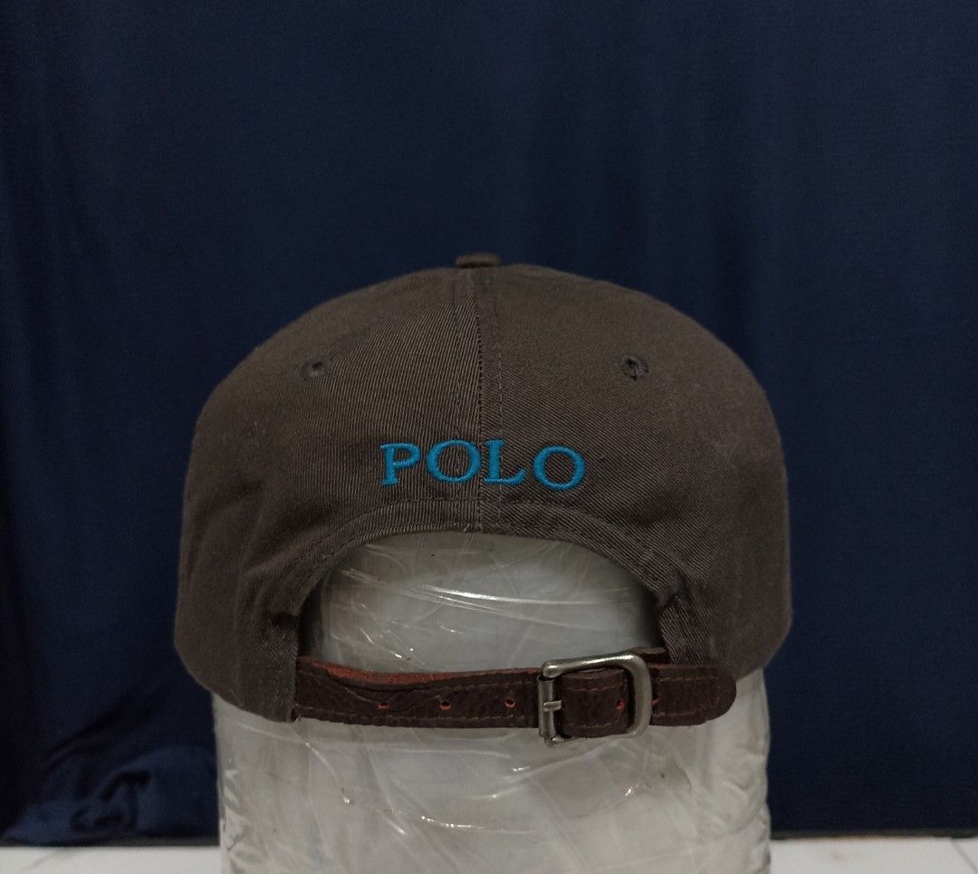 Polo Ralph Lauren Cap - Brown with Blue Logo (Category: Caps & Hats) located in Marawi City. Submitted by abdullah0692139 (Listing ID 1451860096, Image 2). Description: - Authentic Polo Ralph Lauren brown baseball cap - Features the iconic blue polo player logo on the front - 'POLO' embroidered in blue on the back - Adjustable strap with leather detail - Ideal for everyday wear.