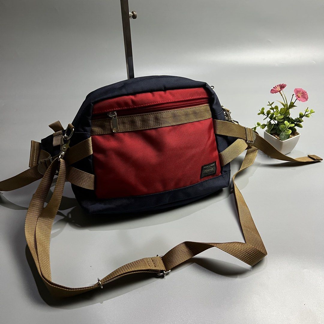 Porter Waist Bag Navy Red Tan (Category: Belt bags, Clutches and Pouches) located in Bago City. Submitted by g___shop (Listing ID 1451825926, Image 2). Description: - Authentic - Porter waist bag - Color: Navy blue, red, and tan panels - Adjustable strap with buckle closure - Zippered main compartment - Front pocket - Durable material - Ideal for travel or everyday use.