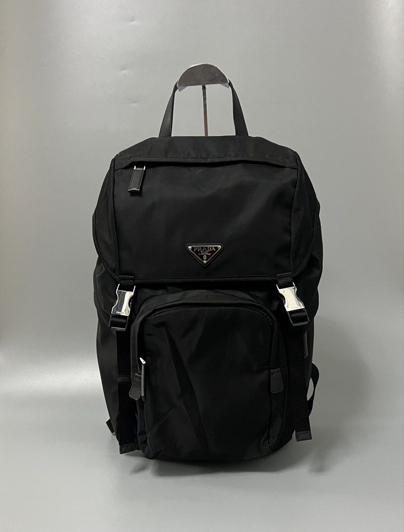 Prada Re-Nylon and Saffiano Leather Backpack (Category: Luxury Bags & Wallets) located in Bacoor. Submitted by southlocalgarage (Listing ID 1451586934, Image 1). Description: Prada Re-Nylon and Saffiano Leather Backpack’ Rank A Lampo underzip Width white tag No.255 As new condition No issue Details! Leather handle Adjustable woven nylon straps Enameled metal triangle logo on flap Push-lock clasp on the flap Four external zipper pockets Padded mes