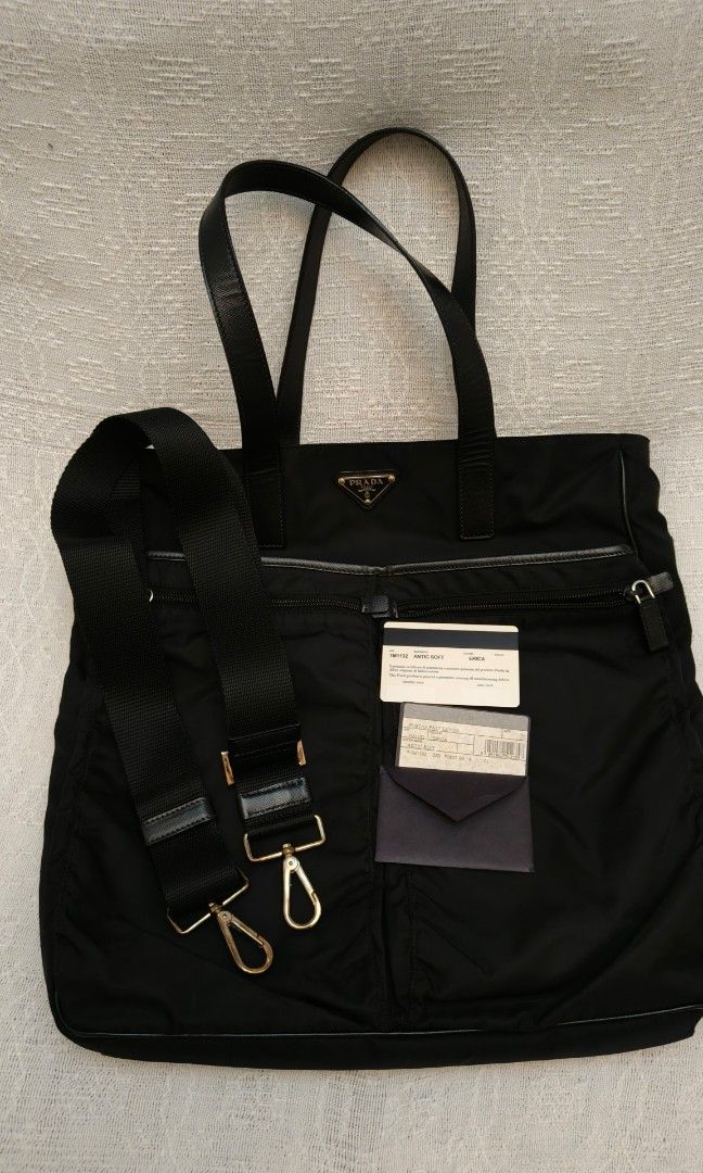 Prada Antic Soft Erica Tote Bag (Category: Luxury Bags & Wallets) located in Makati City. Submitted by emem.pre.owned.ph (Listing ID 1451863591, Image 2). Description: -Authentic Prada Antic Soft Erica Tote/Shoulder Bag -Premium leather handles and trim -Iconic Prada enamel triangle logo -Spacious main compartment with zip closure -Dual front zippered pockets for added organization -Detachable and adjustable shoulder strap -Lightweight, stylish, 