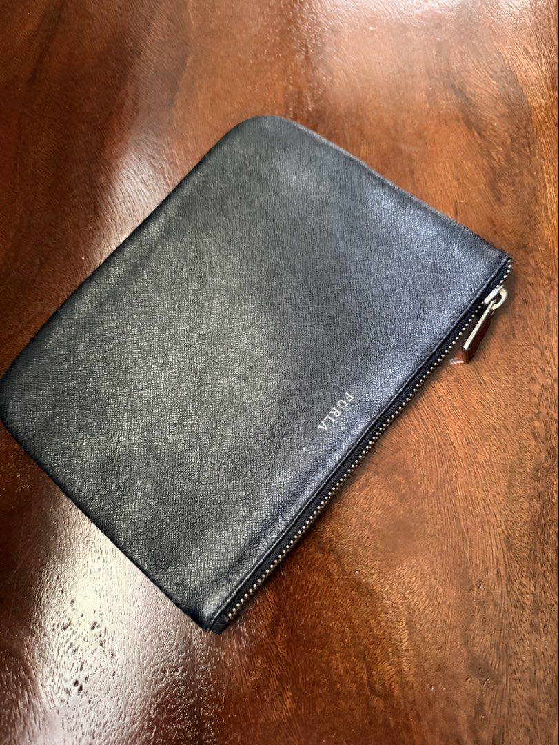 Preloved Furla pouch/clutch bag (Category: Purses & Pouches) located in Naga. Submitted by pritilen (Listing ID 1451709506, Image 3). Description: This is a Furla Saffiano leather black clutch bag featuring a minimalist silver-toned logo. Preloved Authentic Furla roomy, can fit pro max phones .