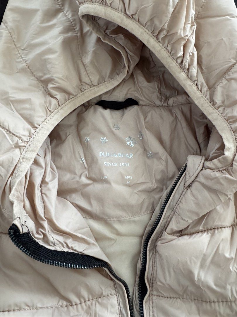 Pull & Bear Light Pink Hooded Puffer Jacket (Category: Coats, Jackets and Outerwear) located in Makati City. Submitted by tinkerboy (Listing ID 1451708959, Image 2). Description: - Light pink puffer jacket from Pull & Bear - Features a hood and zip-up front - Convenient side pockets - Lightweight and warm, perfect for cooler weather - Easy to pack and carry.
