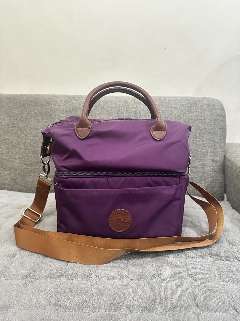 Purple V-Coool Insulated Cooler Bag Two Layer with Shoulder Strap (Category: Other Babies Going Out Needs) located in Antipolo. Submitted by msanjuan (Listing ID 1451840395, Image 2). Description: - Stylish purple V-Coool cooler bag - Insulated interior to keep expressed milk or food warm or cold - Zippered main compartment for secure storage - Convenient front pocket for extra items - Features both top handles and a detachable shoulder strap - I