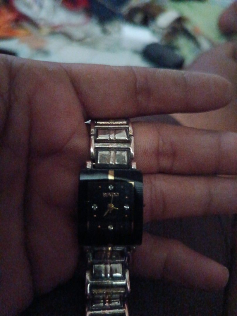 Rado Jubile Watch (Category: Luxury Watches) located in San Jose del Monte. Submitted by lubidmaster (Listing ID 1451728530, Image 1). Description: - Authentic Rado Jubile watch - Elegant black dial with diamond hour markers - Sophisticated silver and gold-toned bracelet - Timeless square case design - Versatile for both daily wear and special events.