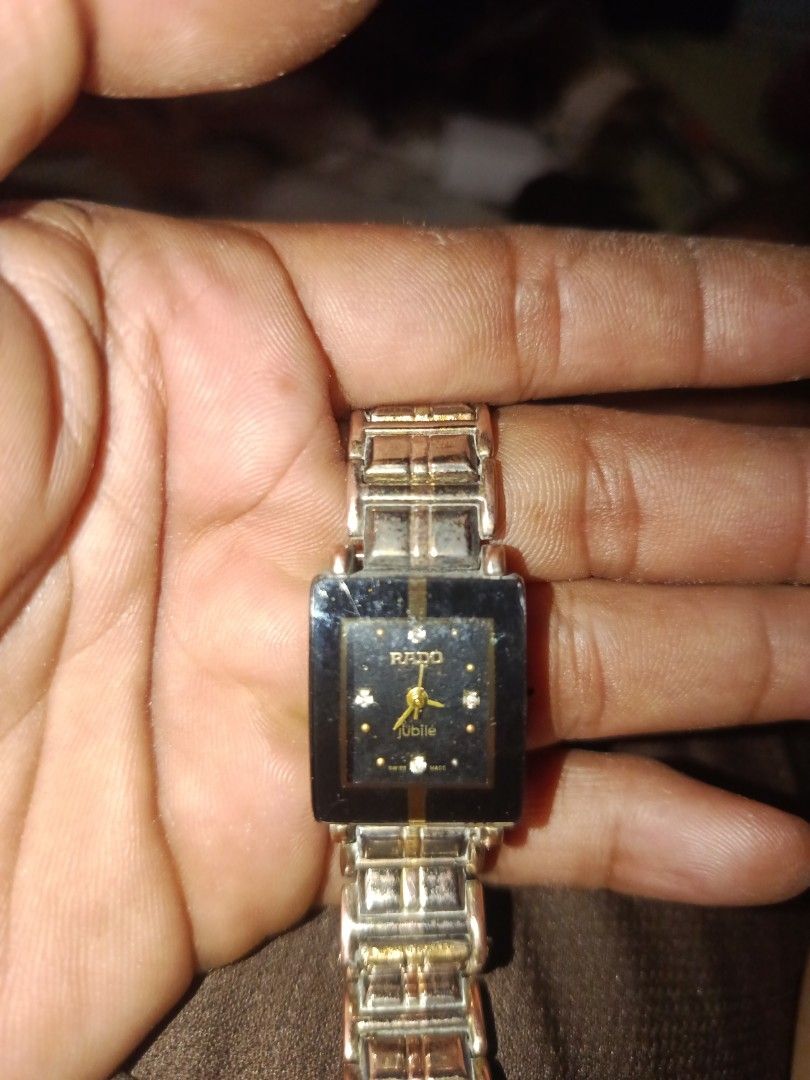 Rado Jubile Watch (Category: Luxury Watches) located in San Jose del Monte. Submitted by lubidmaster (Listing ID 1451728530, Image 2). Description: - Authentic Rado Jubile watch - Elegant black dial with diamond hour markers - Sophisticated silver and gold-toned bracelet - Timeless square case design - Versatile for both daily wear and special events.