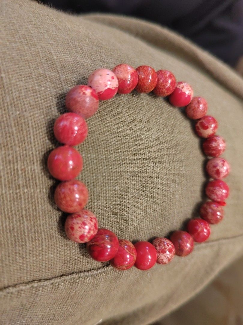 Red Jasper Stone Beaded Bracelet (Category: Bracelets) located in Kuala Lumpur. Submitted by brightowl_464247 (Listing ID 1451724631, Image 1). Description: - Beautiful red jasper beaded bracelet - Lovely marbled pattern with shades of red and pink - Stretchy band for easy wear - Adds a pop of color to any outfit - Perfect for gifting or treating yourself.