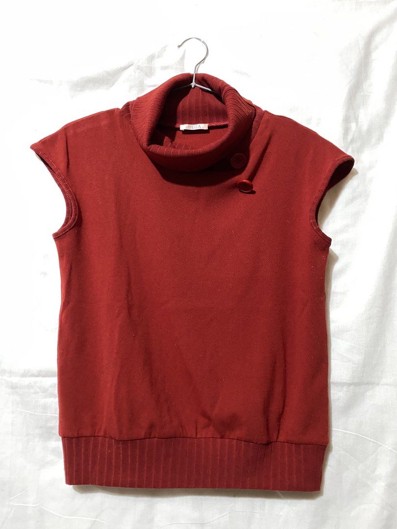 Red Sleeveless Turtleneck Top with Button Detail (Category: Sleeveless) located in Baguio. Submitted by royalriver17 (Listing ID 1451863962, Image 1). Description: Sleeveless turtleneck top with side neck button detail. Ribbed hem. Perfect for layering or casual wear..