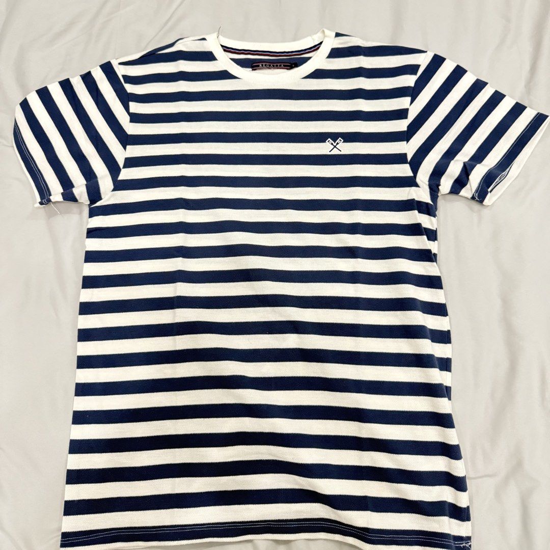 Regatta Striped T-shirt Size L (Category: Tshirts & Polo Shirts ) located in Bocaue. Submitted by mhonluigo (Listing ID 1451844219, Image 1). Description: - Brand: Regatta - Color: Navy and White Stripes - Logo: Embroidered crossed oars on chest - Size: L - Occasion: Casual wear.