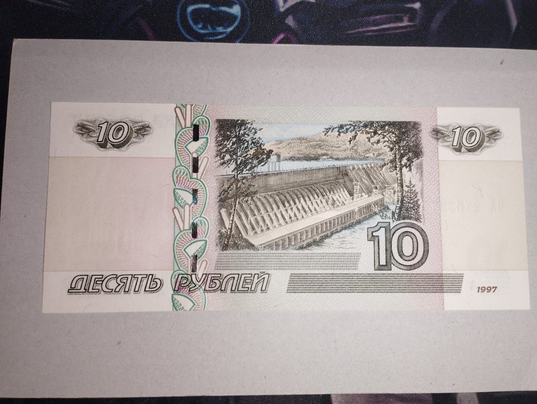 Russia-10 Rubbles (Category: Currency) located in Baguio. Submitted by maximum_carnage (Listing ID 1451799904, Image 2). Description: - Authentic 1997 Russian 10 Ruble banknote - Features the city of Krasnoyarsk on the front - Depicts a hydroelectric power station on the back - Ideal for currency collectors and history enthusiasts - A unique piece of Russian heritage.