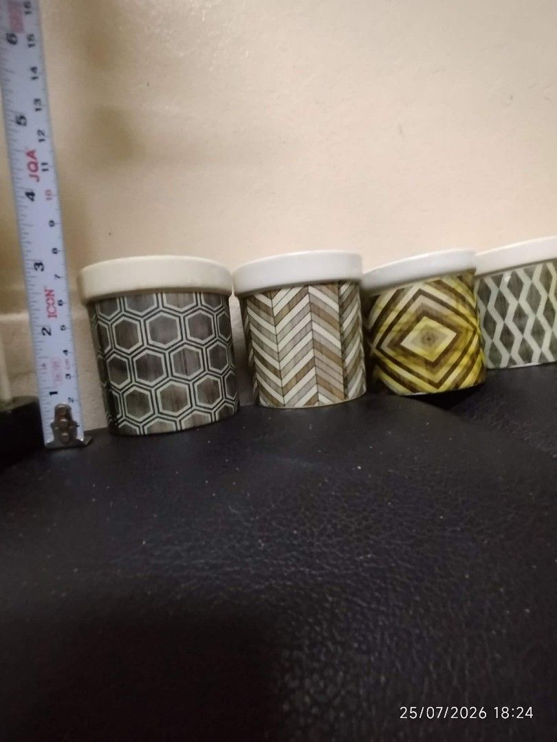 Set of 6 Geometric Pattern Ceramic Pots (Category: Pots & Planters) located in Quezon City. Submitted by chadrison (Listing ID 1451825782, Image 2). Description: - Set of 6 small ceramic pots - Unique geometric patterns on each pot - White rim detail on all pots - Approximately 3 inches tall - Ideal for small plants, succulents, or desk organizers.