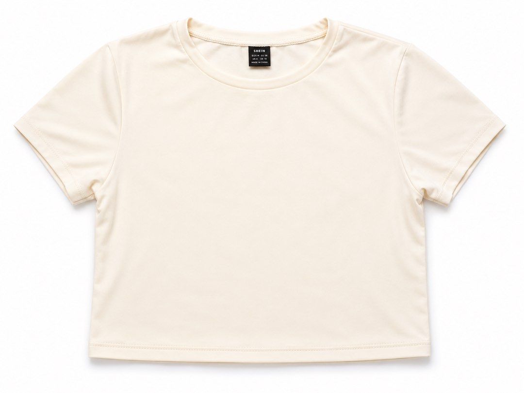 SHEIN Cream Cropped T-shirt (Category: Shirts) located in Makati City. Submitted by PamsCorner (Listing ID 1451845668, Image 1). Description: - Cream colored cropped t-shirt - Brand: SHEIN - Short sleeves - Round neckline - Simple and versatile design - Perfect for layering or wearing on its own - Easy to style with any outfit.