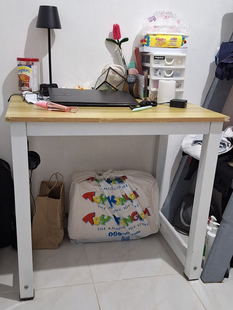 Simple Wooden Top Desk with White Frame (Category: Tables & Sets) located in Quezon City. Submitted by camille_cr (Listing ID 1451746904, Image 1). Description: - Light wood-effect tabletop - Sturdy white metal legs - Spacious surface for laptop and accessories - Ideal for study or small workspace - Easy to assemble.