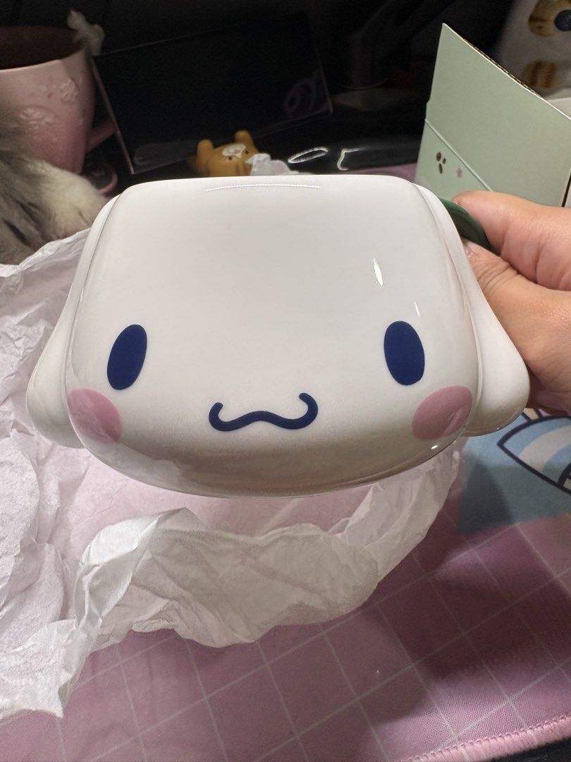 Starbucks Cinnamoroll Collaboration Mug (Category: Coffee & Tea Tableware) located in San Juan City. Submitted by claricecaswell22 (Listing ID 1451820169, Image 3). Description: - Adorable Cinnamoroll Starbucks collaboration mug. - Comes with its original box. - Features Cinnamoroll's face on the front. - Collaboration logo on the back. - Dark green handle detail. - Ideal for coffee or tea lovers. - Perfect gift for Cinnamoroll and Starbucks fans