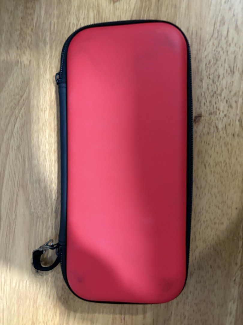 Switch Oled - Slim Case (Category: Cases & Covers) located in Quezon City. Submitted by ricardo7_ (Listing ID 1451809079, Image 2). Description: Slim case for Nintendo Switch oled. Good condition. Red color. With 10 cartridge slot. .