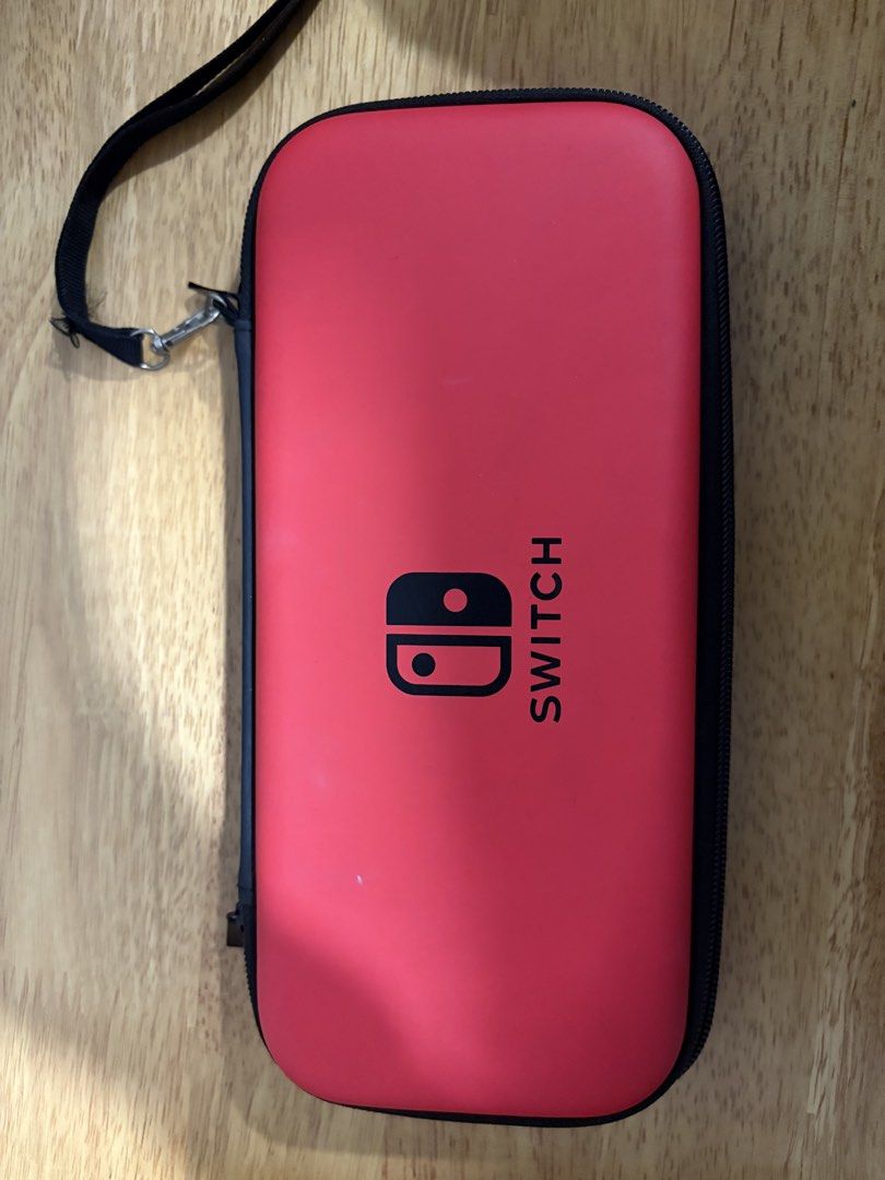 Switch Oled - Slim Case (Category: Cases & Covers) located in Quezon City. Submitted by ricardo7_ (Listing ID 1451809079, Image 1). Description: Slim case for Nintendo Switch oled. Good condition. Red color. With 10 cartridge slot. .