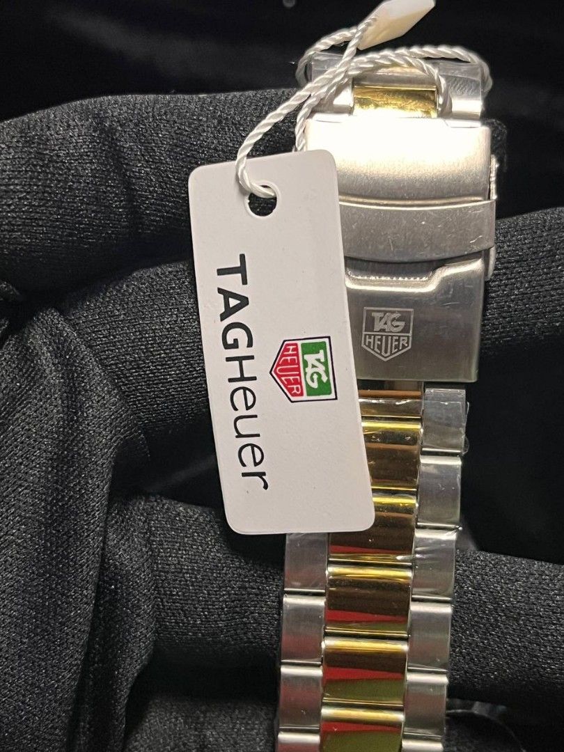TAG Heuer Two-Tone Chronograph Watch (Category: Luxury Watches) located in Manila. Submitted by seannathan46011 (Listing ID 1451868794, Image 3). Description: - OEM TAG Heuer Watch - Two-tone Stainless Steel and Gold Bracelet - Black Dial with Chronograph display - Water Resistant .