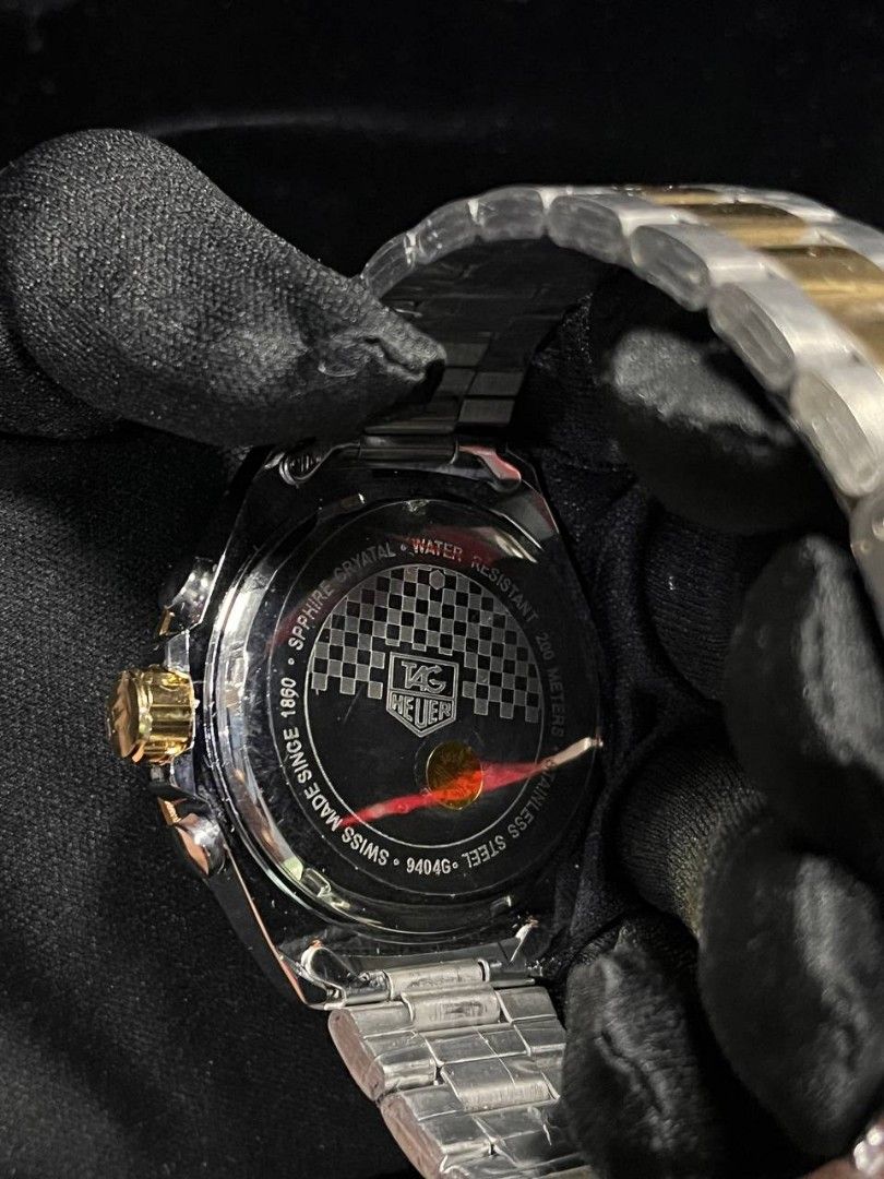 TAG Heuer Two-Tone Chronograph Watch (Category: Luxury Watches) located in Manila. Submitted by seannathan46011 (Listing ID 1451868794, Image 2). Description: - OEM TAG Heuer Watch - Two-tone Stainless Steel and Gold Bracelet - Black Dial with Chronograph display - Water Resistant .