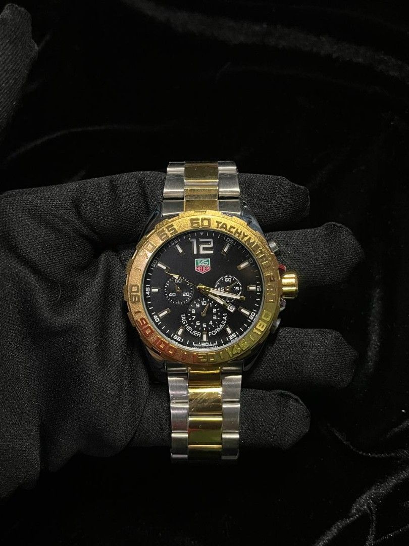 TAG Heuer Two-Tone Chronograph Watch (Category: Luxury Watches) located in Manila. Submitted by seannathan46011 (Listing ID 1451868794, Image 1). Description: - OEM TAG Heuer Watch - Two-tone Stainless Steel and Gold Bracelet - Black Dial with Chronograph display - Water Resistant .
