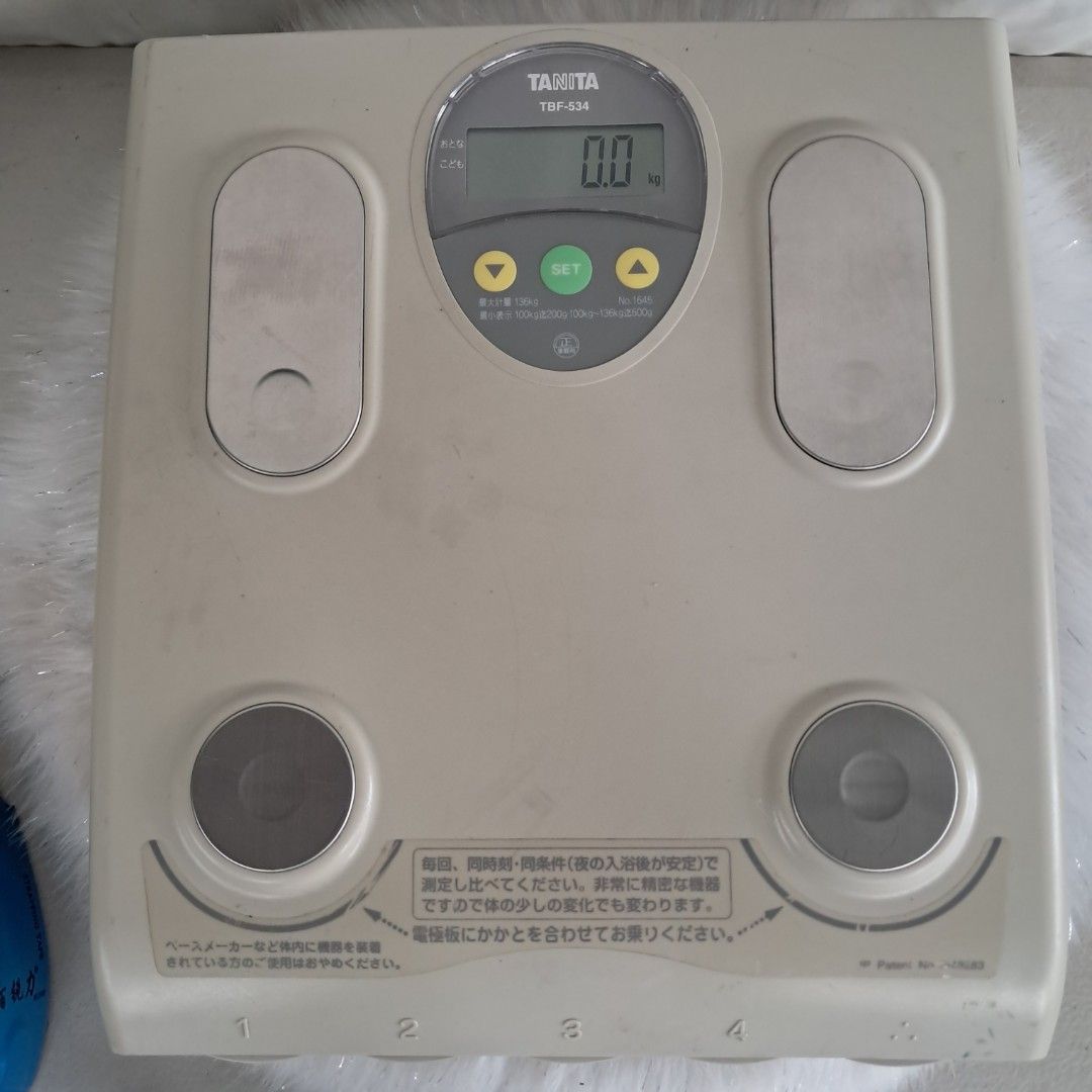 Tanita TBF-534 Body Composition Scale (Category: Health Monitors & Weighing Scales) located in Bulacan. Submitted by amarijapansurplus (Listing ID 1451785409, Image 1). Description: - Tanita TBF-534 body composition scale - Measures weight in kilograms (kg) - User-friendly buttons for setting and adjusting values - Clear display showing 0.0 kg - Four metal contact points for body composition measurement - Ideal for tracking your health metrics - 