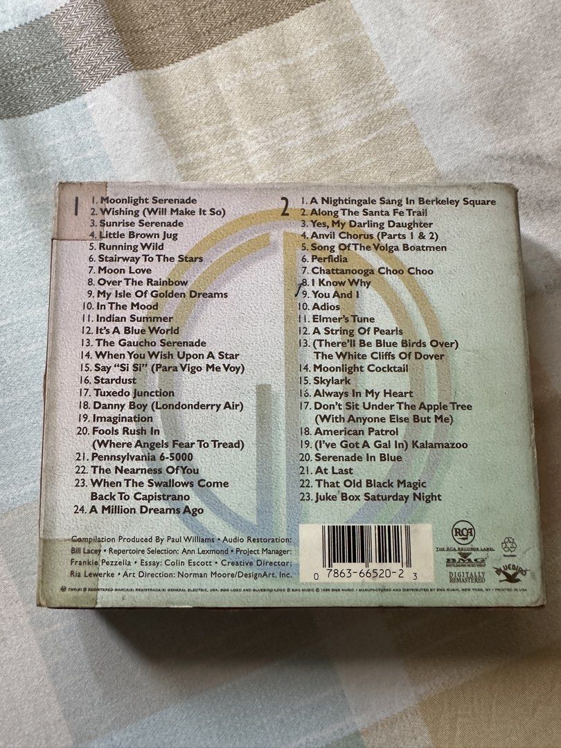 The Essential Glenn Miller CD (Category: CDs & DVDs) located in Quezon City. Submitted by declutter_incorporated (Listing ID 1451726723, Image 2). Description: - The Essential Glenn Miller CD - Packed with classic jazz tunes - Includes 'Moonlight Serenade', 'In The Mood', and more - A must-have for any jazz lover - Compilation produced by Paul Williams - Features audio restoration by Bill Lacey.