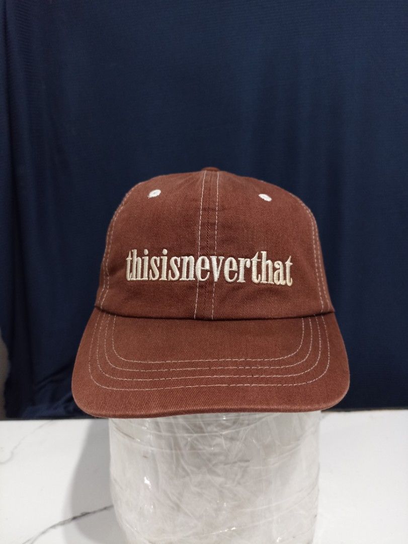 thisisneverthat Brown Embroidered Logo Baseball Cap (Category: Caps & Hats) located in Marawi City. Submitted by abdullah0692139 (Listing ID 1451860502, Image 1). Description: - Brand: thisisneverthat - Color: Brown - Design: Classic baseball cap - Feature: White embroidered logo on front - Fit: Adjustable strap at the back - Style: Versatile, great for everyday wear and matches most outfits.