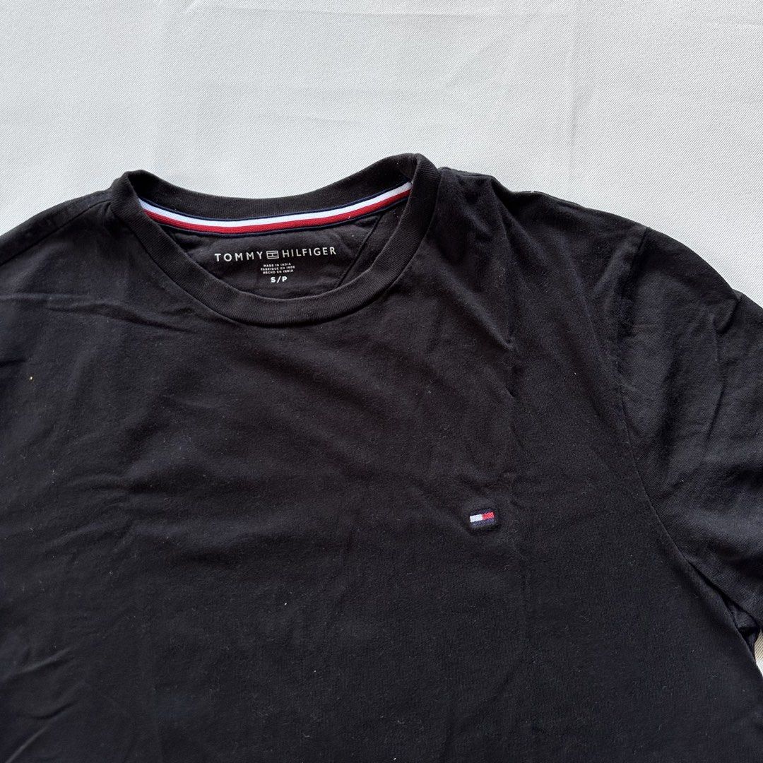 Tommy Hilfiger Black T-Shirt (Category: Tshirts & Polo Shirts ) located in Quezon City. Submitted by ys4bella (Listing ID 1451705542, Image 2). Description: - Classic black t-shirt from Tommy Hilfiger - Features the small, iconic logo on the chest - Simple and versatile design - Great for everyday wear - Size: S/P.
