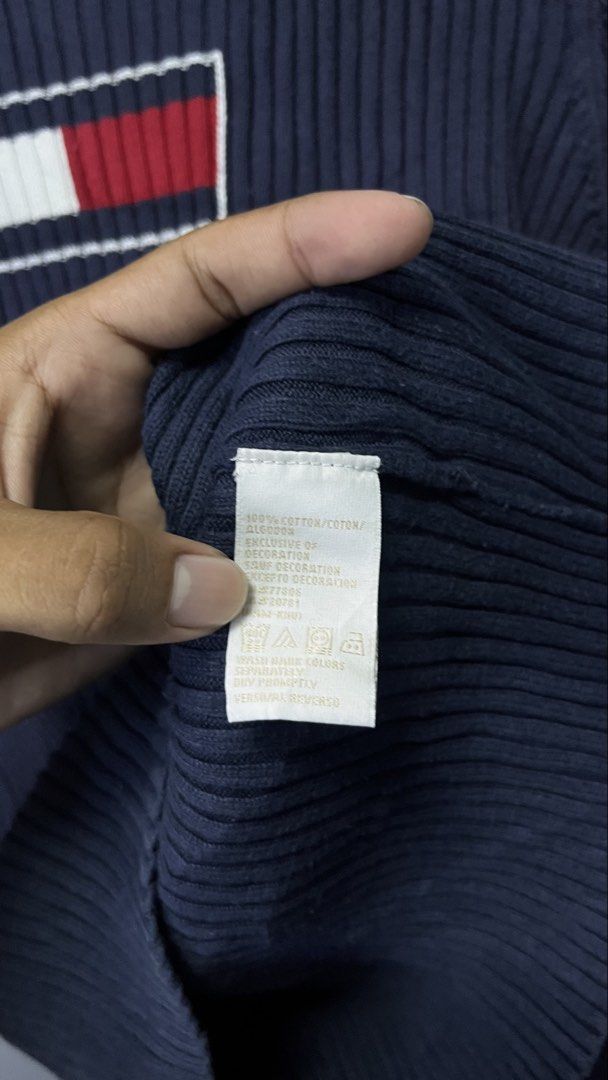 Tommy Hilfiger Navy Blue Ribbed Sweater Size M (Category: Longsleeves) located in Cabuyao City. Submitted by bulandos (Listing ID 1451852568, Image 3). Description: - Navy blue ribbed sweater - Brand: Tommy Hilfiger - Classic Tommy flag logo on chest - Material: 100% Cotton - Size: Medium (M) - Origin: Made in Hong Kong - Versatile for layering or standalone wear.