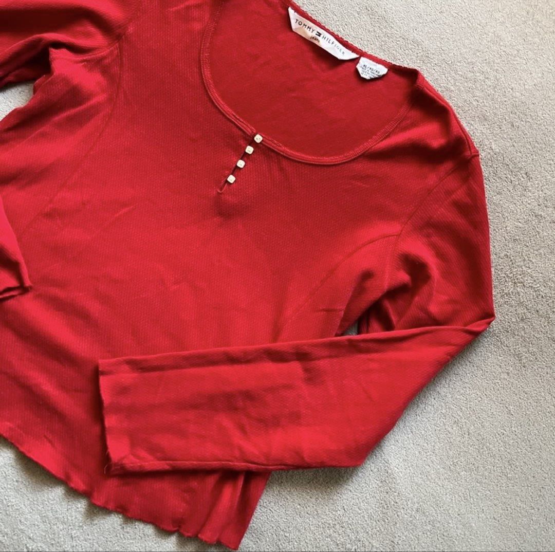 Tommy Hilfiger Red Blouse Top Long Sleeves (Category: Longsleeves) located in Naga. Submitted by kitty_cate02 (Listing ID 1451809709, Image 2). Description: Pre-owned Used twice In good condition - Brand: Tommy Hilfiger - Color: Red - Style: Long-sleeved top - Neckline: Scoop neck with 3-button henley placket - Texture: Subtle ribbed fabric - Hem: Slightly ruffled - Details: Tommy Hilfiger logo tag on sleeve cuff - Occasion: Casual wear Authentic