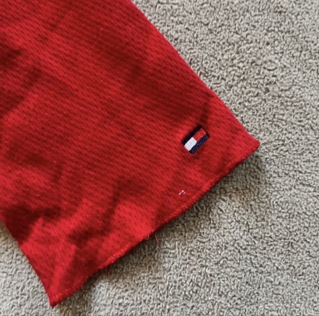 Tommy Hilfiger Red Blouse Top Long Sleeves (Category: Longsleeves) located in Naga. Submitted by kitty_cate02 (Listing ID 1451809709, Image 3). Description: Pre-owned Used twice In good condition - Brand: Tommy Hilfiger - Color: Red - Style: Long-sleeved top - Neckline: Scoop neck with 3-button henley placket - Texture: Subtle ribbed fabric - Hem: Slightly ruffled - Details: Tommy Hilfiger logo tag on sleeve cuff - Occasion: Casual wear Authentic