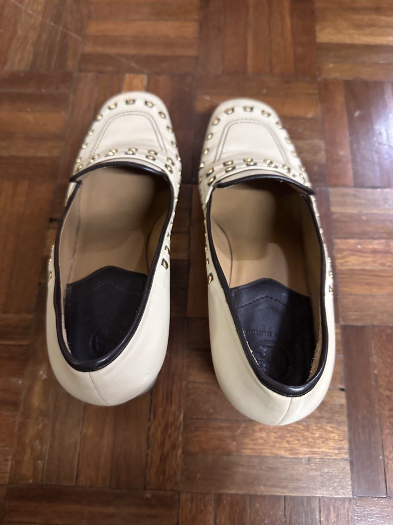 Tory Burch Cream Leather Studded Loafers (Category: Loafers) located in Paranaque City. Submitted by declutter_therapy (Listing ID 1451841098, Image 3). Description: - Brand: Tory Burch - Color: Cream - Material: Leather - Style: Loafers - Size: 8 - Details: Gold-tone stud embellishments around the edges - Insole: Features Tory Burch logo - Origin: Made in Italy.