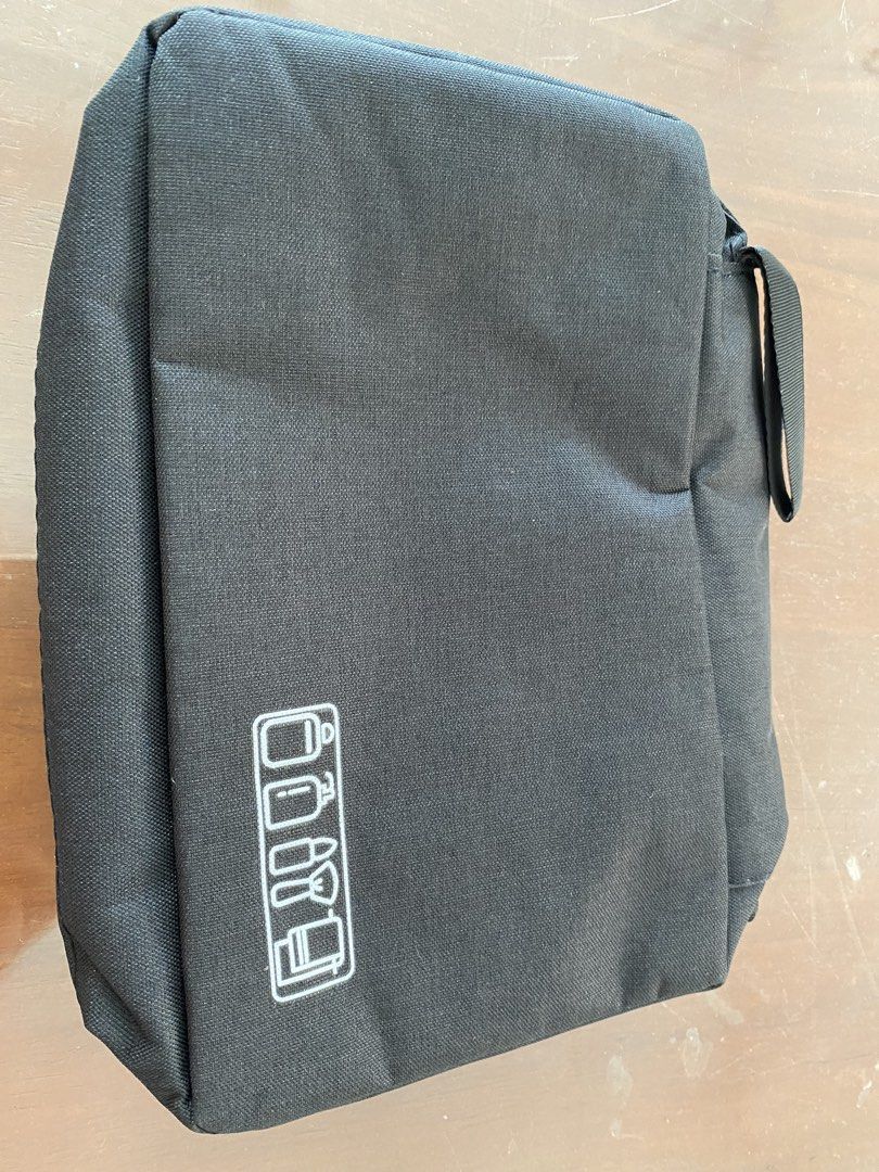 Travel Toiletry Bag with Hook - Black Polyester (Category: Purses & Pouches) located in Bacoor. Submitted by gracemc2024 (Listing ID 1451722594, Image 1). Description: - Durable black toiletry bag perfect for travel. - Made from sturdy 300D polyester material. - Multiple compartments for organized storage. - Includes a convenient mesh pocket. - Features a built-in hook for hanging. - Compact and easy to pack when folded..