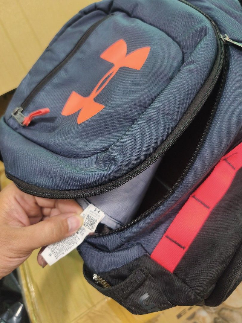 Under Armour Undeniable 3.0 (Category: Backpacks) located in Manila. Submitted by fel0230 (Listing ID 1451742692, Image 3). Description: This is an Under Armour Undeniable 3.0 backpack, featuring a vibrant red logo and a prominent red strap detail on a dark blue and black body..