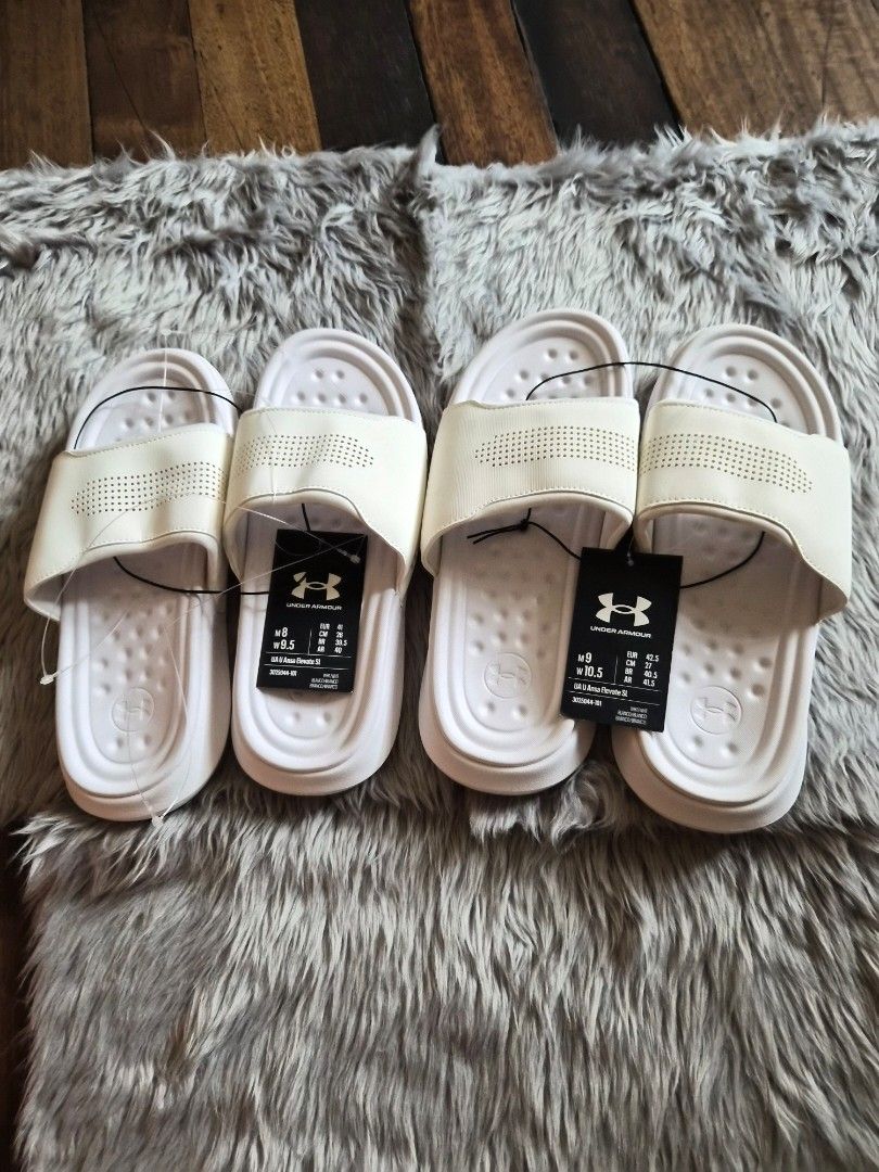 Under Armour White Slides Sandals (Category: Slippers & Slides) located in Manila. Submitted by jayy2021 (Listing ID 1451714117, Image 1). Description: Brand new old stock under armour slides. size 9 and 8 US php 600 for both..