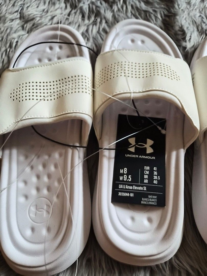 Under Armour White Slides Sandals (Category: Slippers & Slides) located in Manila. Submitted by jayy2021 (Listing ID 1451714117, Image 2). Description: Brand new old stock under armour slides. size 9 and 8 US php 600 for both..