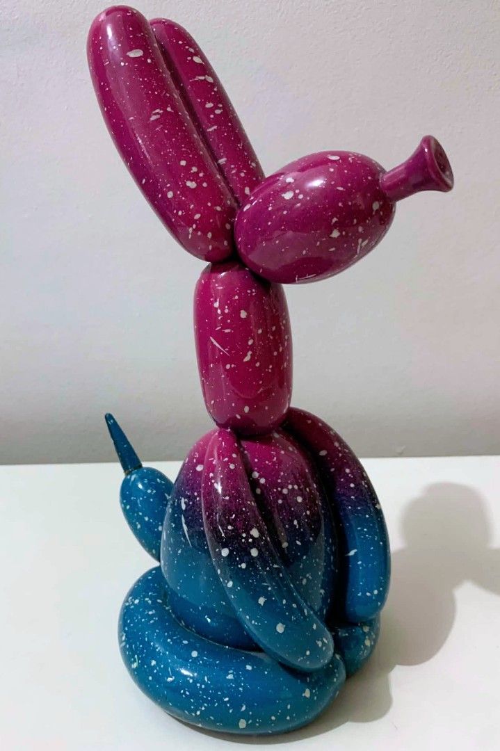 Unique Balloon Dog Decor Sculpture - Galaxy Design (Category: Other Home Decor) located in Quezon City. Submitted by dfabloveverything (Listing ID 1451874529, Image 3). Description: - Unique balloon dog sculpture with a stunning galaxy design. - Features a beautiful gradient from deep blue to vibrant magenta. - Speckled with white and gold paint for an artistic touch. - Adds a pop of color and fun to any room. - Ideal for displaying on shelves, d