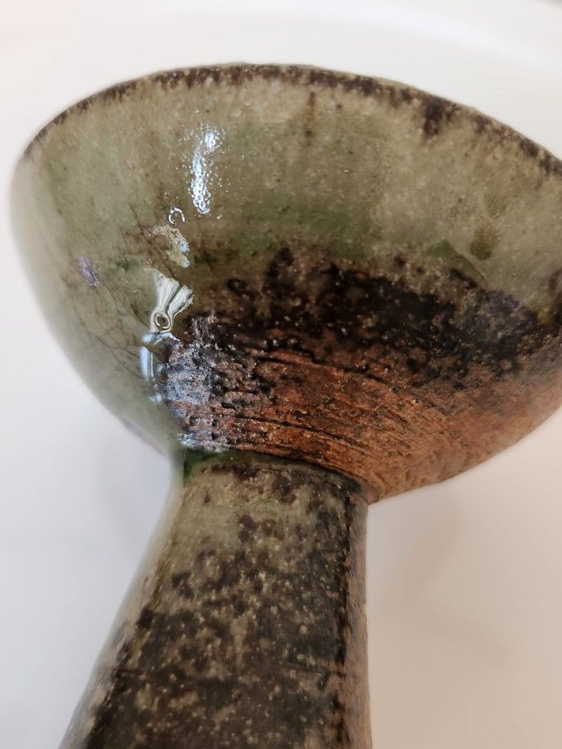 Unique Ceramic Bud Vase with Rustic Glaze (Category: Vases & Decorative Bowls) located in Kuala Lumpur. Submitted by gentlepenguin.6b8aad (Listing ID 1451808297, Image 3). Description: - Handcrafted ceramic vase - Unique speckled glaze with earthy tones - Ideal for a single stem or decorative piece - Adds rustic charm to any space - Approximately 5 inches tall - Great for home decor.