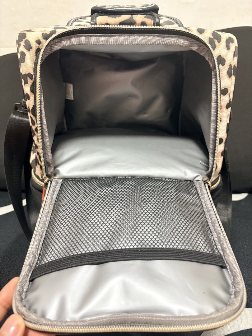 V-Cool Leopard Print Cooler Bag with Ice Packs (Category: Food Organization & Storage) located in Marikina City. Submitted by loca. (Listing ID 1451770353, Image 2). Description: - V-Cool leopard print cooler bag - Includes two V-Cool ice packs - Main compartment for storage - Front zip pocket for essentials - Adjustable shoulder strap for easy carrying - Ideal for keeping food and drinks cool during travel or outings.