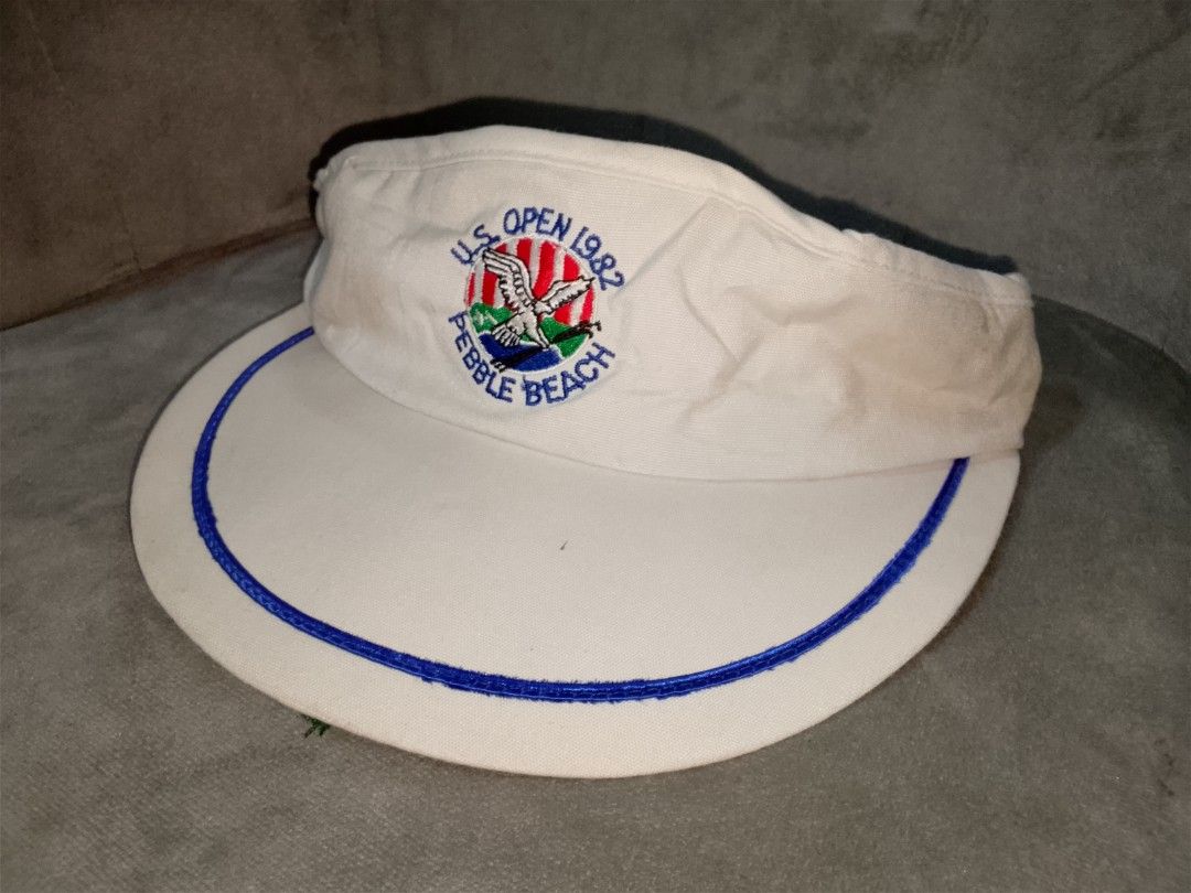 Vintage 1982 US Open Pebble Beach Golf Visor (Category: Caps & Hats) located in Binangonan. Submitted by yuristalin888 (Listing ID 1451837616, Image 1). Description: - Vintage visor from the 1982 US Open at Pebble Beach - White with blue trim and embroidered logo - Adjustable strap with metal buckle - Perfect for golf memorabilia collectors - Issue see 3 last photos.