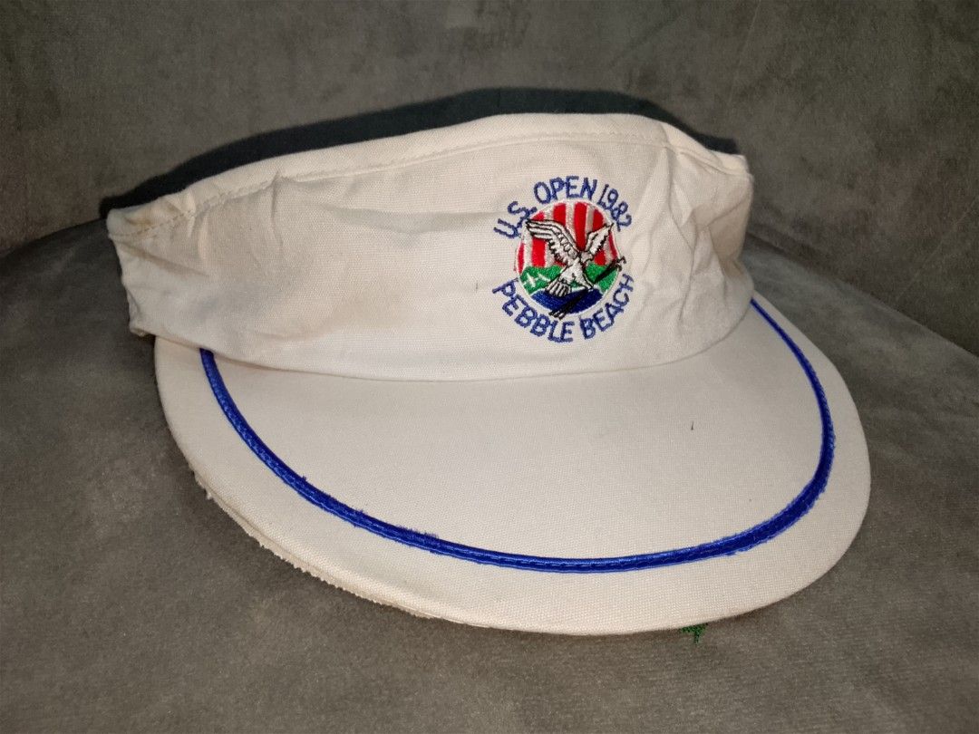 Vintage 1982 US Open Pebble Beach Golf Visor (Category: Caps & Hats) located in Binangonan. Submitted by yuristalin888 (Listing ID 1451837616, Image 2). Description: - Vintage visor from the 1982 US Open at Pebble Beach - White with blue trim and embroidered logo - Adjustable strap with metal buckle - Perfect for golf memorabilia collectors - Issue see 3 last photos.