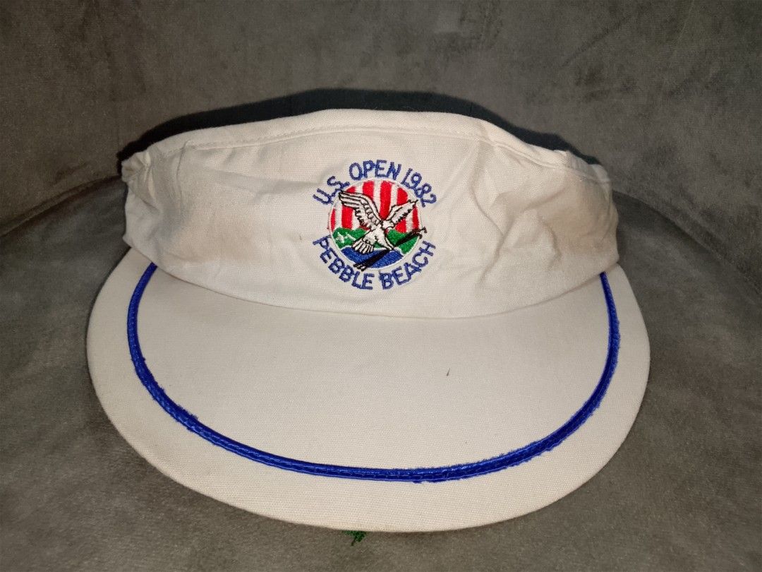 Vintage 1982 US Open Pebble Beach Golf Visor (Category: Caps & Hats) located in Binangonan. Submitted by yuristalin888 (Listing ID 1451837616, Image 3). Description: - Vintage visor from the 1982 US Open at Pebble Beach - White with blue trim and embroidered logo - Adjustable strap with metal buckle - Perfect for golf memorabilia collectors - Issue see 3 last photos.