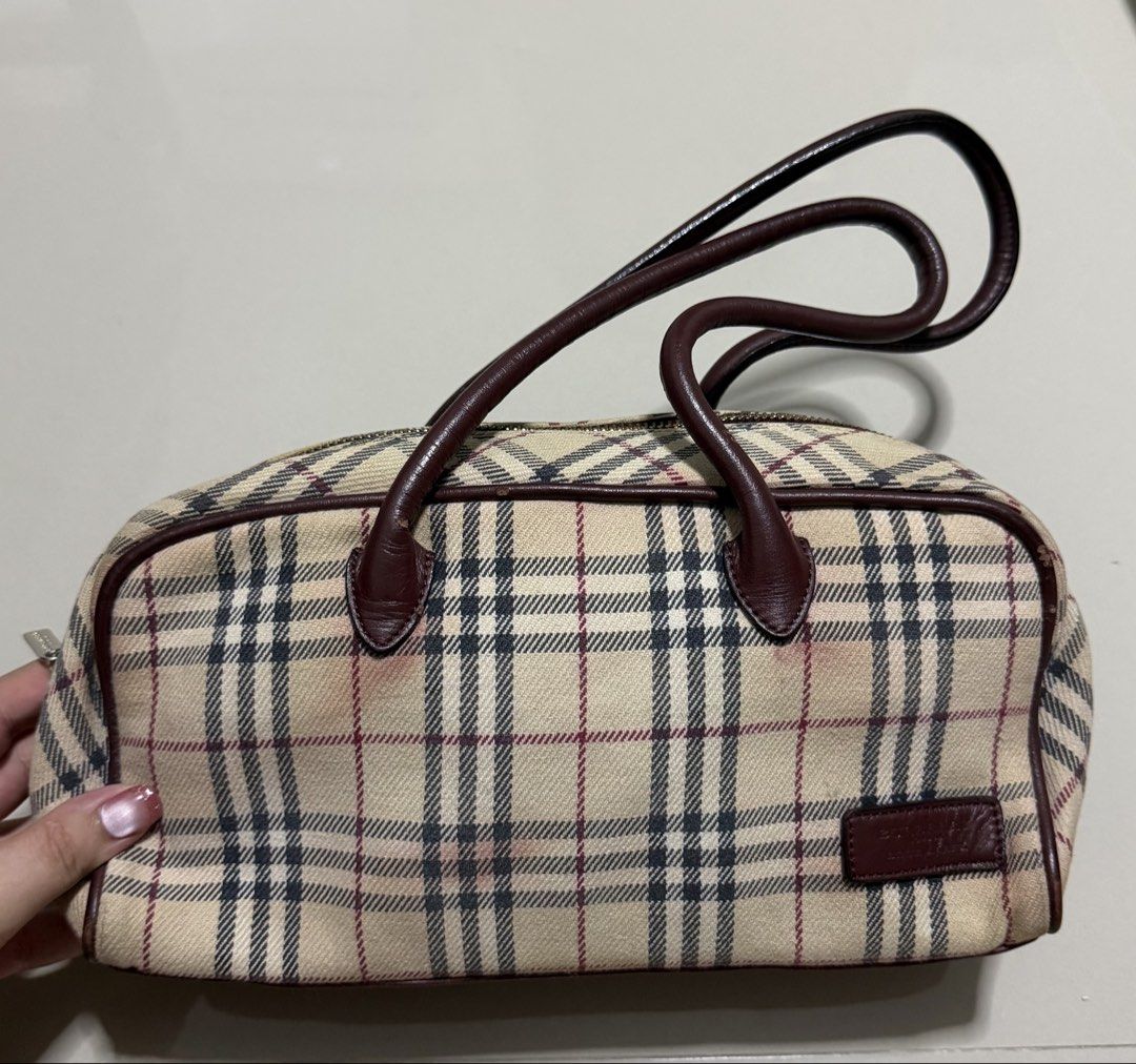 Vintage Burberry Blue Label handbag (Category: Luxury Bags & Wallets) located in Pasig City. Submitted by dancieaa03 (Listing ID 1451868304, Image 2). Description: - Classic Burberry Haymarket check handbag - Beige canvas with signature check pattern - Leather trim and handles - Handles show some wear - Secure zipper closure .