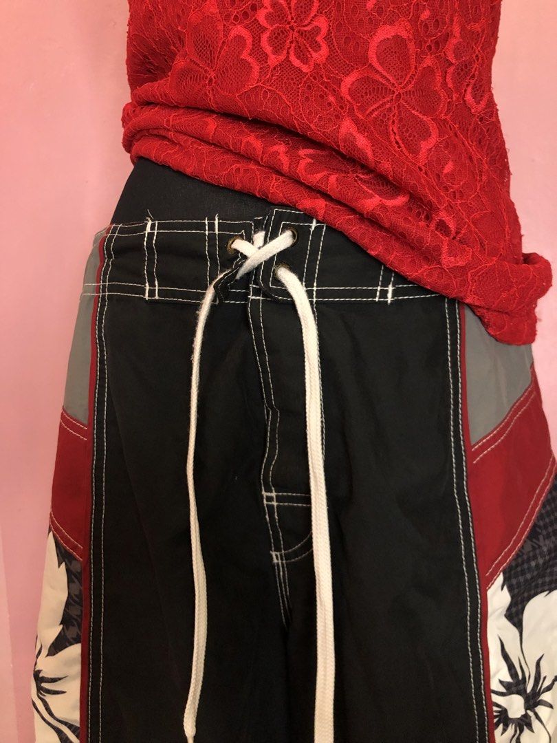 Y2k Bundle! Speedo Board Shorts with Red Sequined Top Y2k (Category: Shorts) located in Manila. Submitted by pinay2000sfinds (Listing ID 1451820190, Image 3). Description: - Brand: Speedo - Color: Black with red and grey panels - Design: Cool floral print on the sides - Features: Drawstring waist - Ideal for: Swimming, lounging, beach trips.