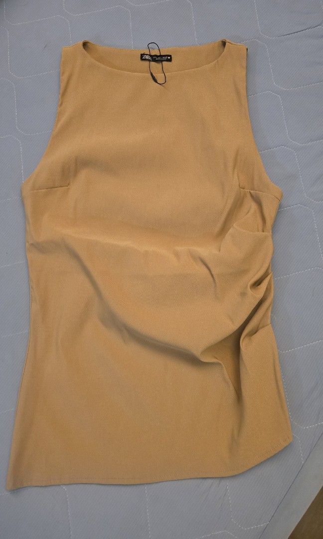 Zara Camel Sleeveless Top (Category: Sleeveless) located in Taguig. Submitted by c_rivera (Listing ID 1451851707, Image 1). Description: like new. fits medium to semi large. stretchy. nice fit. rfs decluttering.