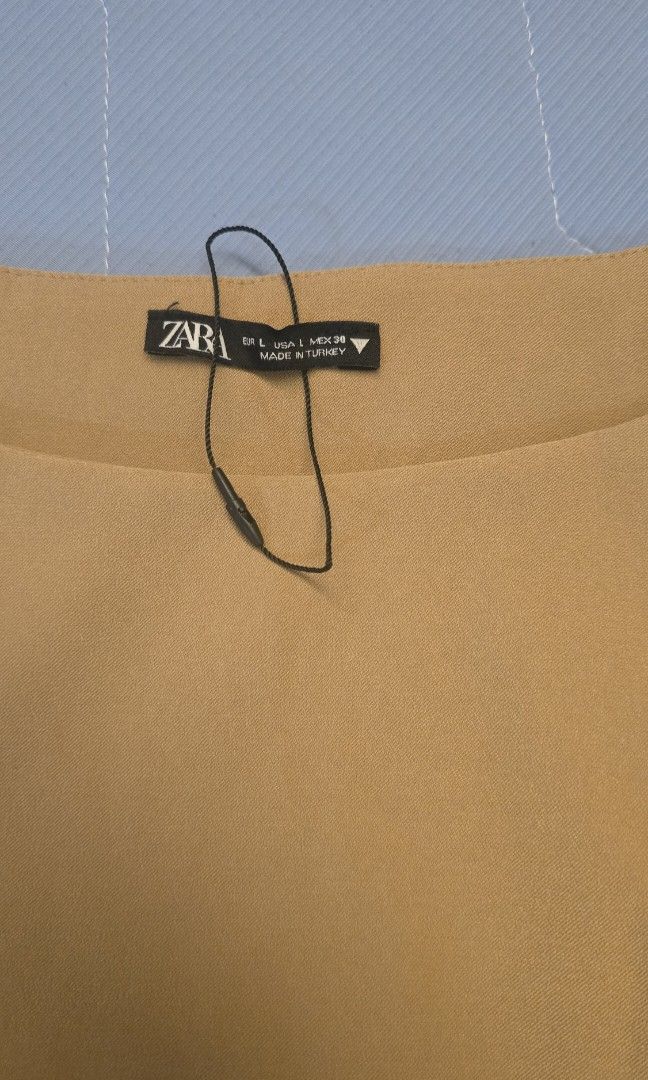 Zara Camel Sleeveless Top (Category: Sleeveless) located in Taguig. Submitted by c_rivera (Listing ID 1451851707, Image 2). Description: like new. fits medium to semi large. stretchy. nice fit. rfs decluttering.