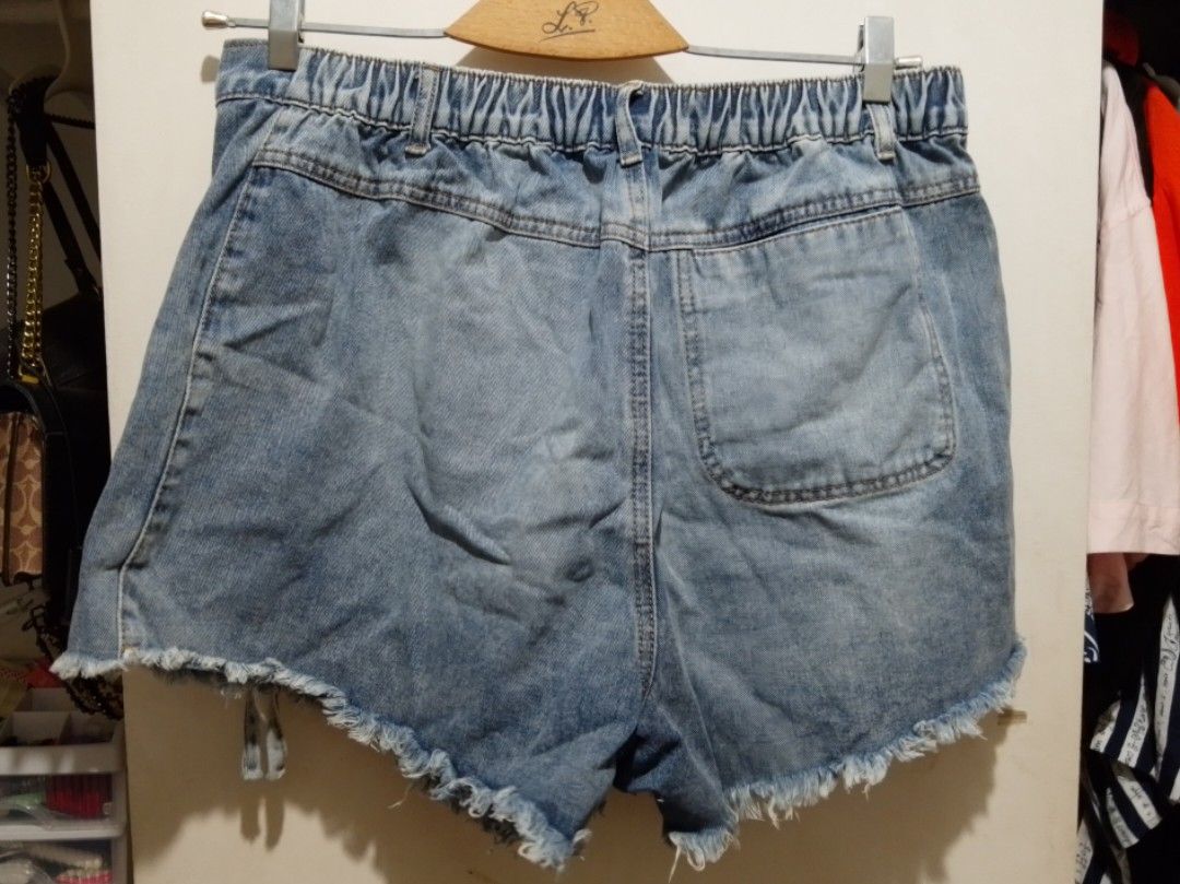 (1XL) Shein Denim Wrap Skort (Category: Shorts) located in Rizal. Submitted by rmrkshmc (Listing ID 1452049485, Image 2). Description: - 1XL - ideally fits 36-38 - washed blue denim with raw hem line - with 1 working back pocket - garterized at the back - mop: gcash - loc: Mayamot, Antipolo.