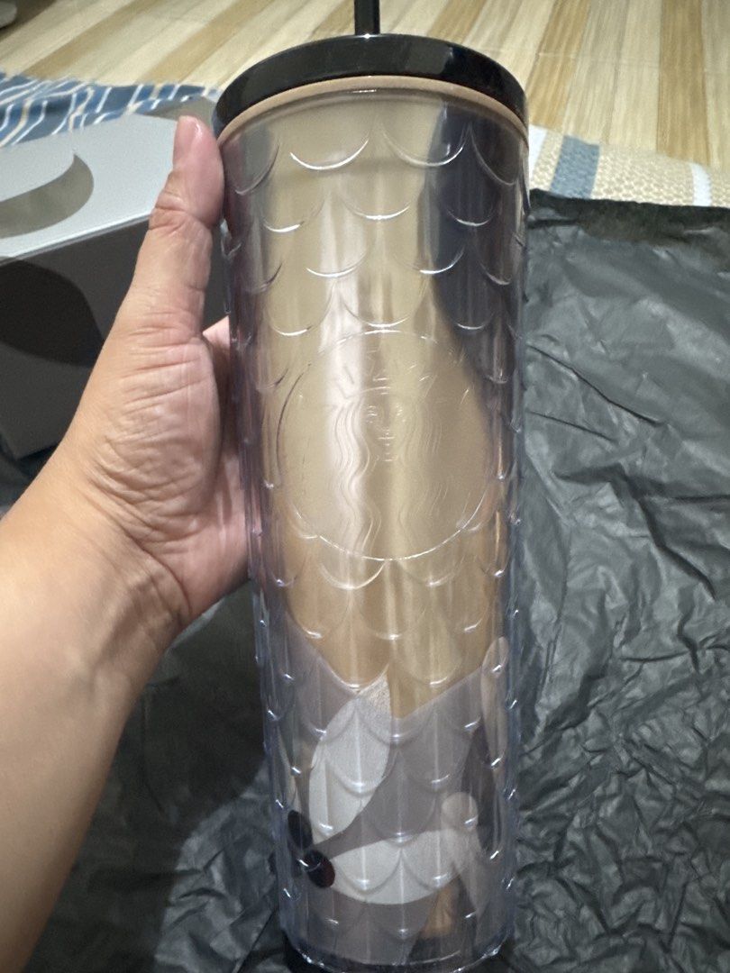 2026 Starbucks Tumbler with Box (Category: Water Bottles & Tumblers) located in Valenzuela. Submitted by djforlales (Listing ID 1451994941, Image 2). Description: - Stylish Starbucks tumbler with a unique textured, scale-like pattern. - Includes original Starbucks box, perfect for gifting or safekeeping. - Features a light tan interior for a clean look. - Comes with a sleek black lid and a matching black straw. - Ideal for your daily beverages, k