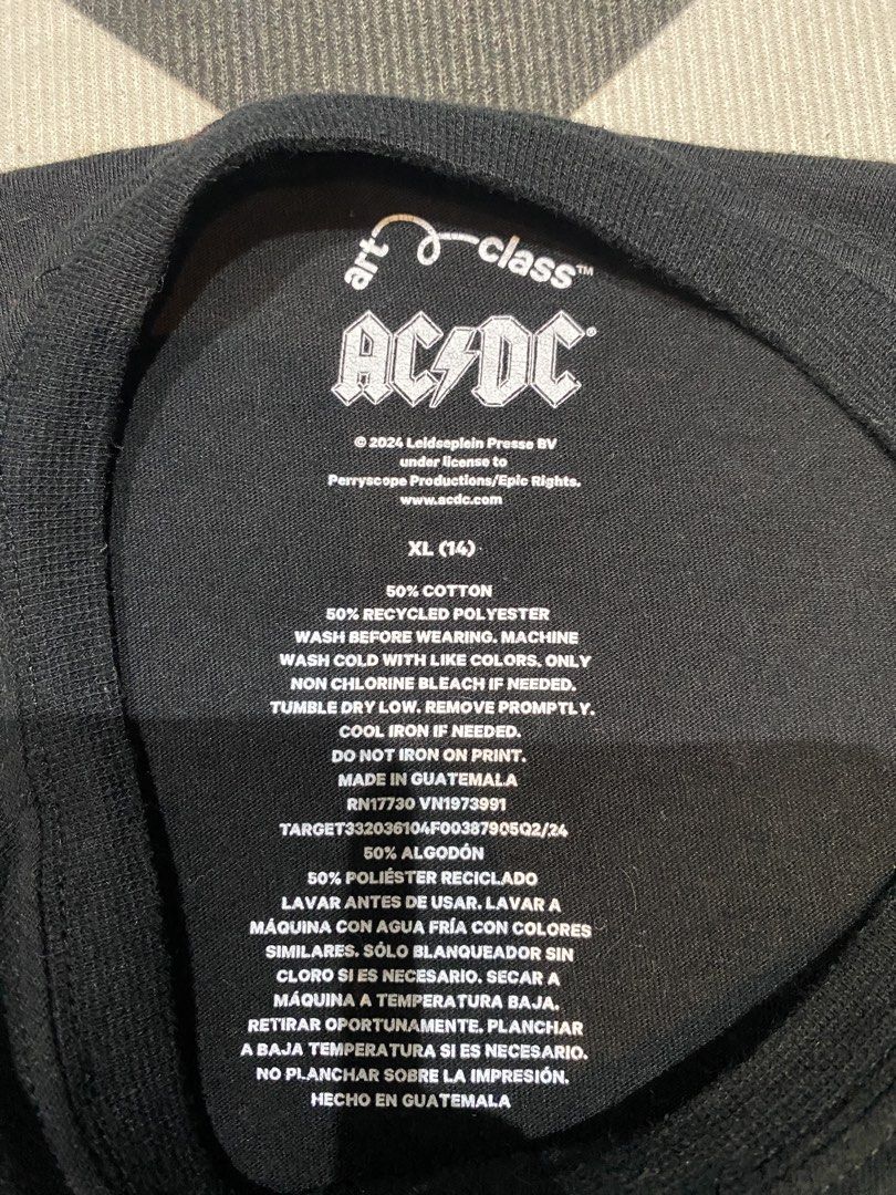 AC/DC Graphic T-Shirt XL (14) (Category: Tshirts & Polo Shirts ) located in Manila. Submitted by salaspasio80393 (Listing ID 1451929049, Image 3). Description: - Black AC/DC graphic t-shirt - Size XL (14) - Features iconic band logo and Angus Young graphic - Material: 50% recycled polyester, 50% cotton blend - Care: Machine washable - Ideal for any AC/DC fan.