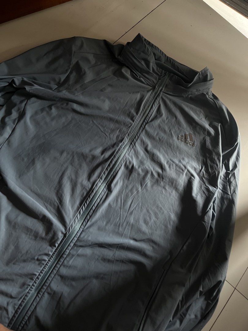 Adidas Light Weight Track Jacket (Category: Coats, Jackets and Outerwear) located in Santa Ana. Submitted by rlave (Listing ID 1452001076, Image 1). Description: Preloved Adidas blue full-zip windbreaker jacket, part of the Sports Life line, featuring the embroidered/printed Adidas logo on the chest, lightweight woven fabric, and a full-zip closure. Comfortable relaxed fit — great for training, layering, or everyday casual wear. Item is in good p